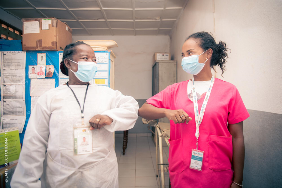 An ACCESS staff member mentors a community health worker.