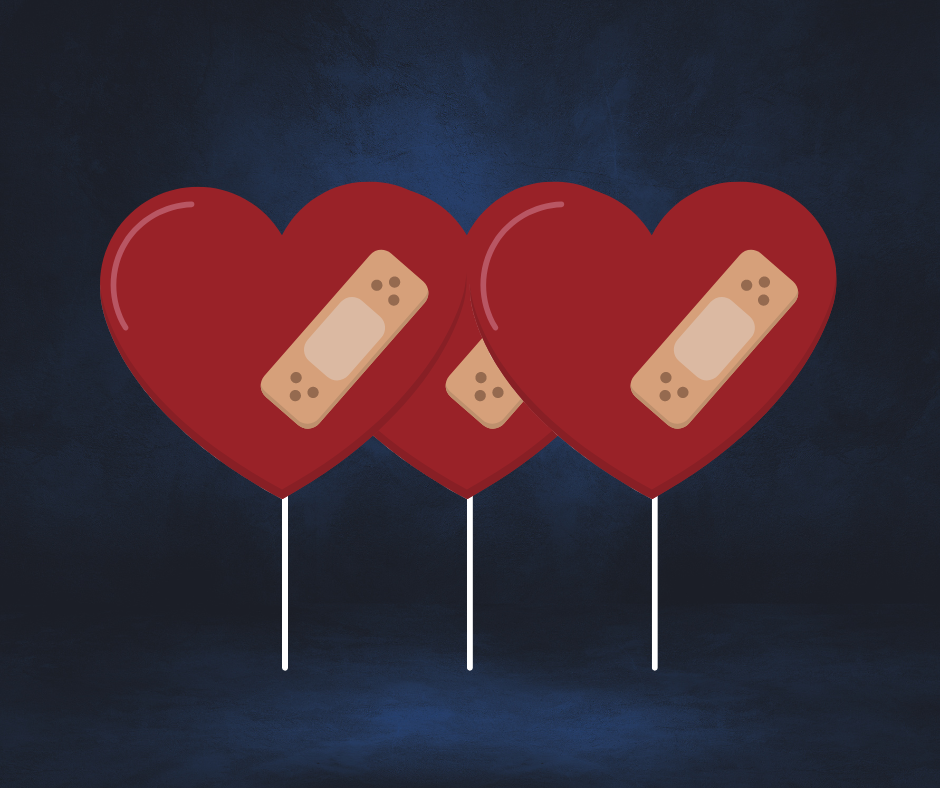 Three heart ballons with bandaids