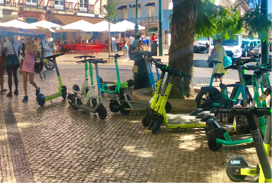 Electric Scooters at Busy Street Corner