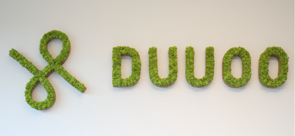 Duuoo logo on a white wall