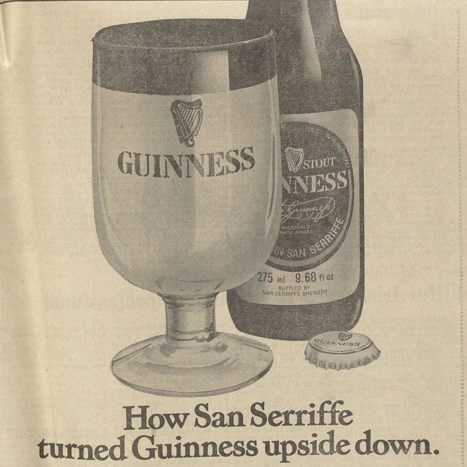Advert by Guinness featured in the San Serriffe Report. Reads ‘how San Serriffe turned Guinness upside down’. Shows a full glass of Guinness which is mostly white topped with a layer of black. Guinness bottle sits behind glass. Courtesy of Guardian News & Media