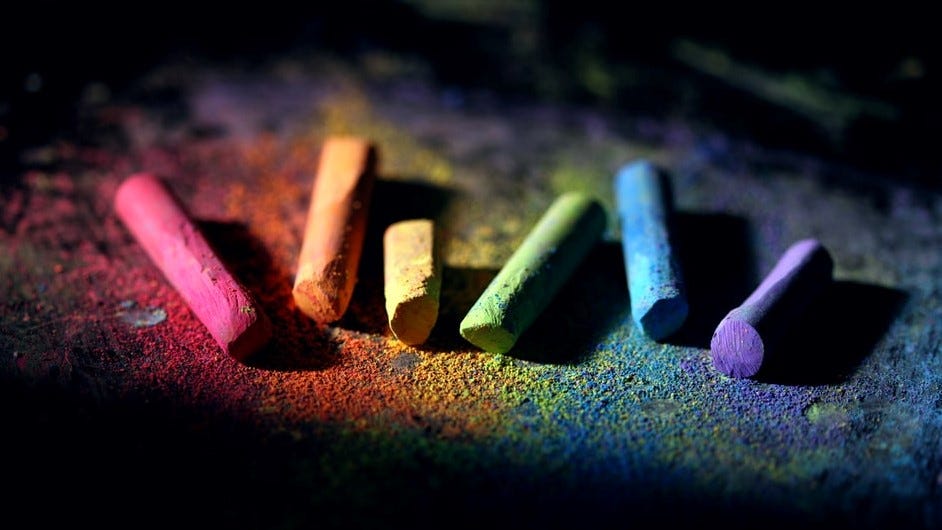 Rainbow chalk on black