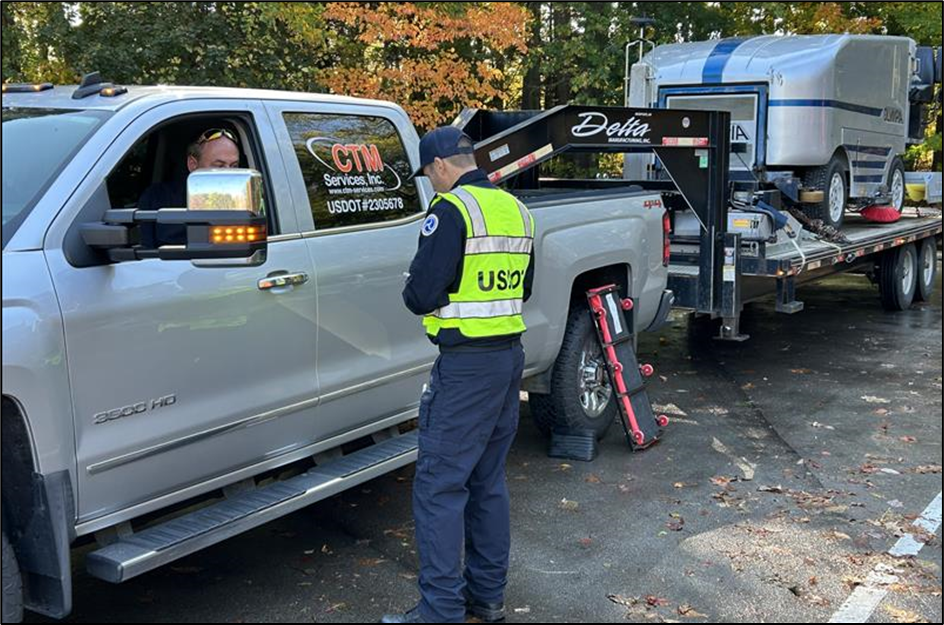 Pennsylvania Division Safety Investigator Michael Appolonia speaks with a driver during the I-90 HotShot Initiative.