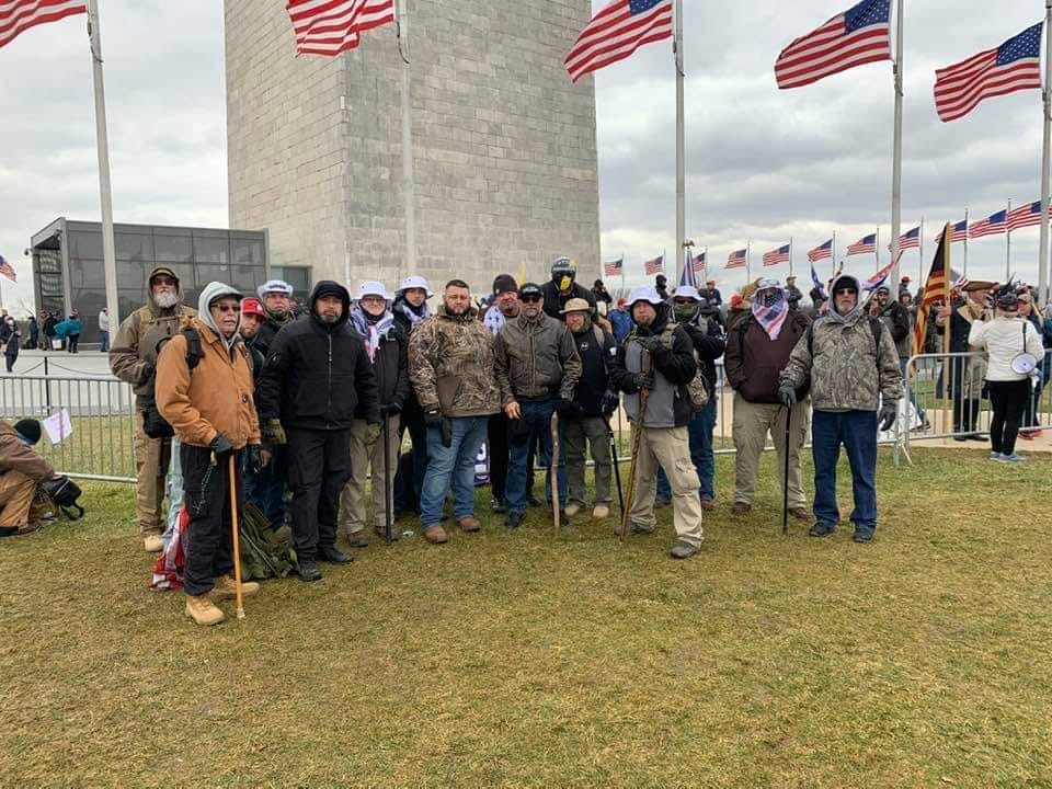 10–15 North Carolina Oath Keepers posing for a picture in front of the Washington Monument