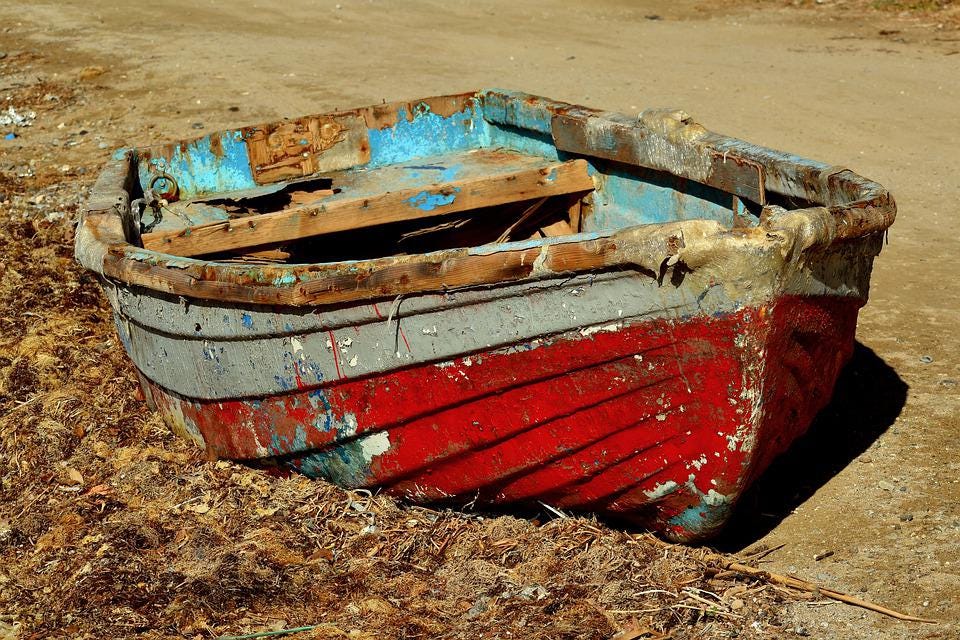 old, broken wooden dinghy