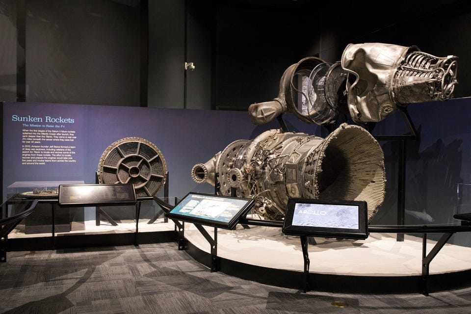 Recovered F-1 engine components are on display at the Museum of Flight with related exhibit information.