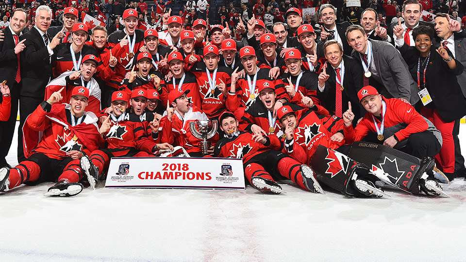 Canada’s 2018 National Junior Team celebrates their win by posing for group photo.