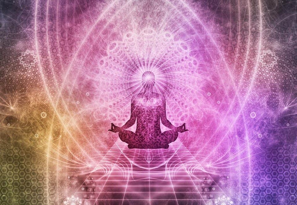 Live a better life by being mindful - person meditating with colorful background