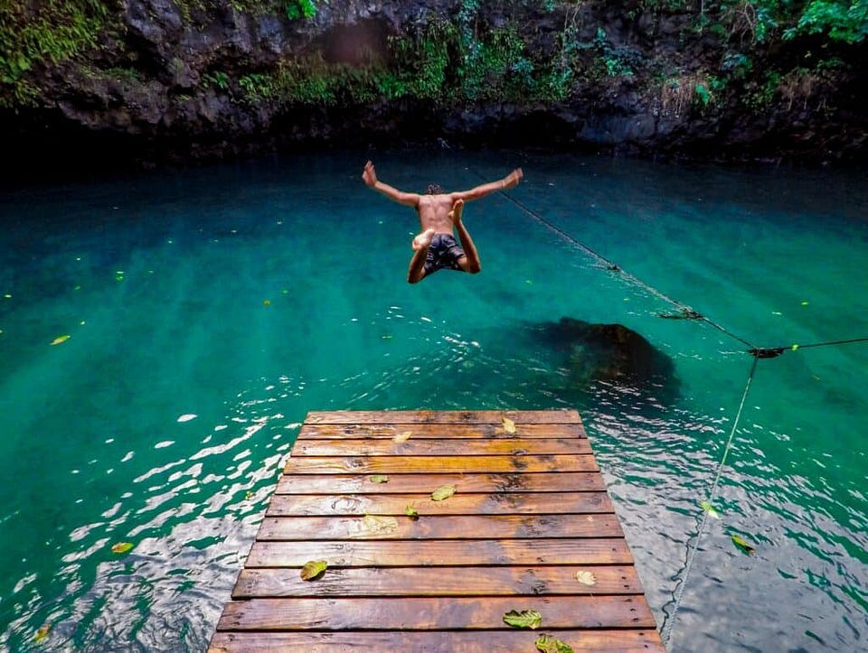 man taking a leap into the water, like taking the leap to reinvent yourself
