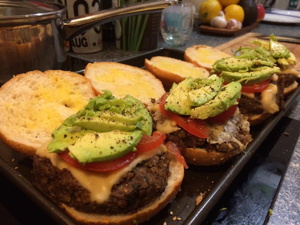 Scott Jurek’s mushroom lentil burgers, topped with vegan cheese, tomatoes and avocado.