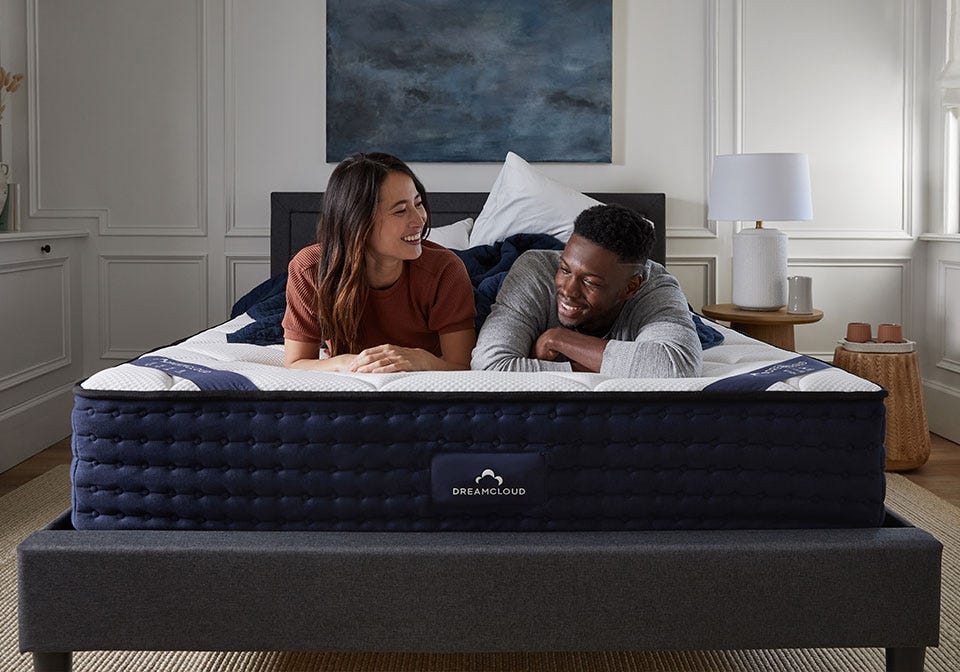 Couple on Dreamcloud best mattress for scoliosis