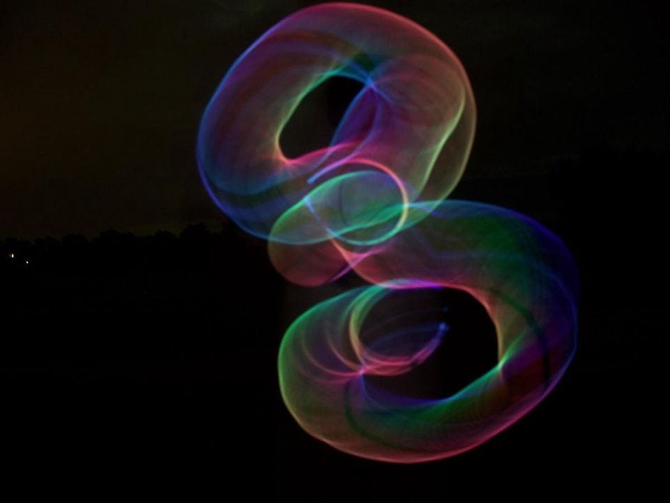 An artistic rendering of how string theory might explain how dimensions may intersect and loop back on each other