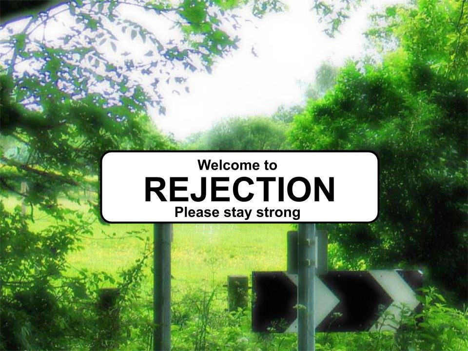 Image of a road sign with ‘Welcome to REJECTION Please stay strong’