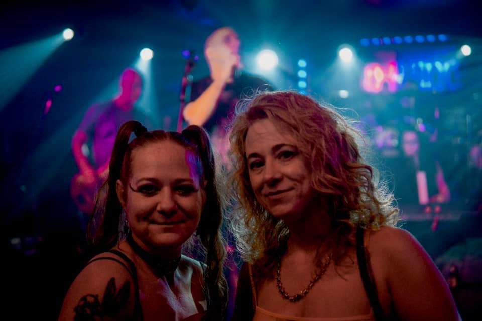 sisters at a rock show