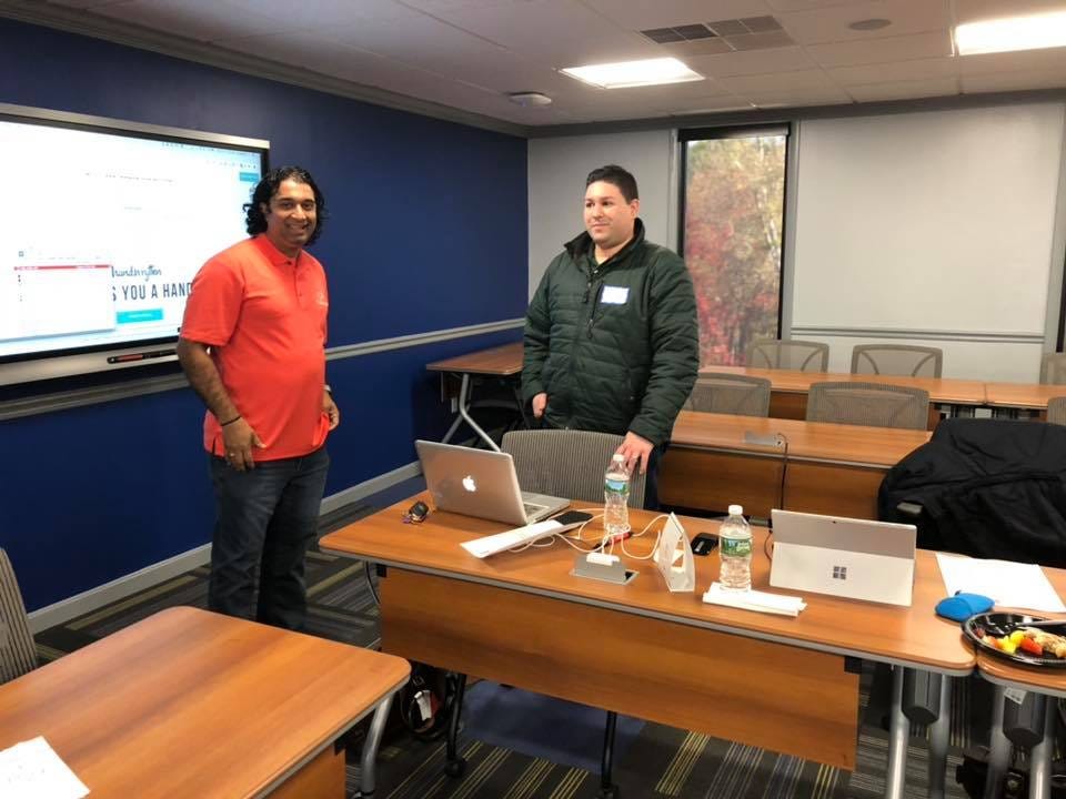 Krishna Malyala (left), iconic for always wearing orange & Mike DelRose Jr. (right), taking a break during a CyberProfessionals conference that took place in Warwick, RI in 2018. The pair would end up working together in early 2020.