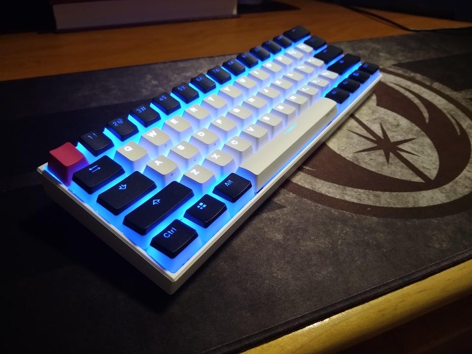 Anne Pro 2 with pudding keycaps (translucent on the bottom, solid with shine-through font on the top)