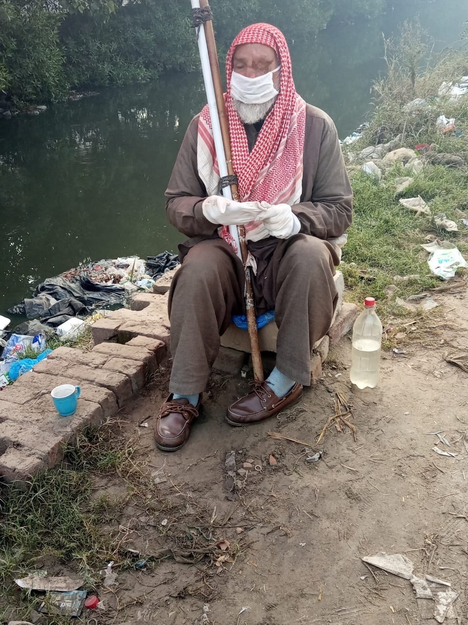 A mentally impaired old blind man who sit at a drain all day(Sejpal Town,Lahore)