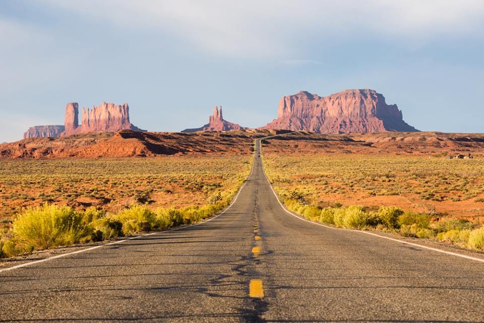 Road in central United States, going on to rocky formations