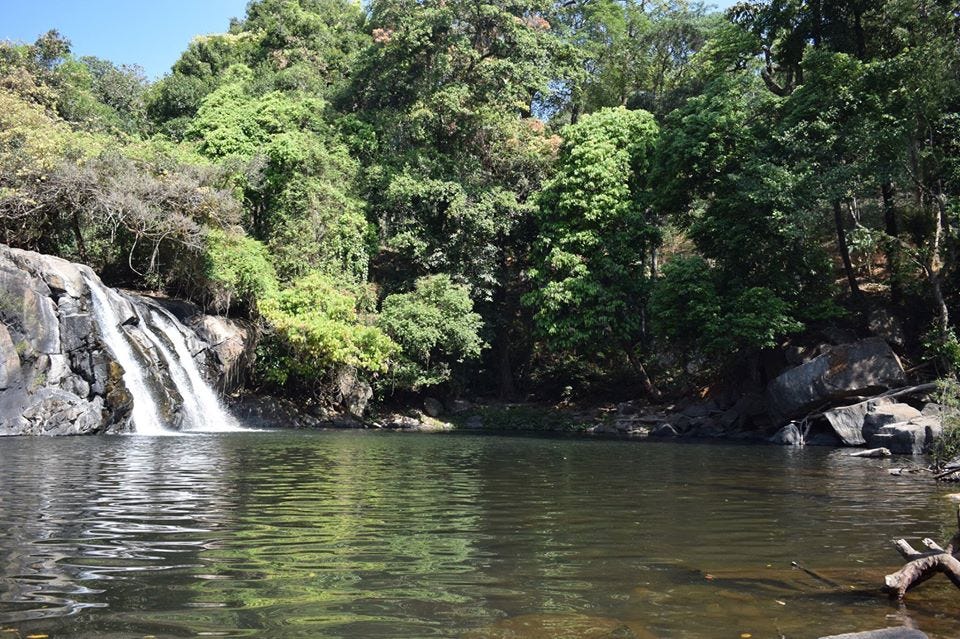 photography of kodi abbey waterfall at coorg