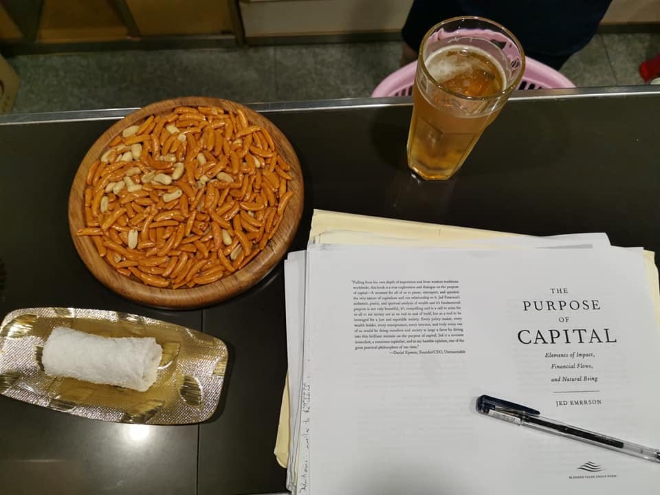 Reading the opening page of Jed Emerson’s “The Purpose of Capital” at the bar of the Pyongyang Hotel.