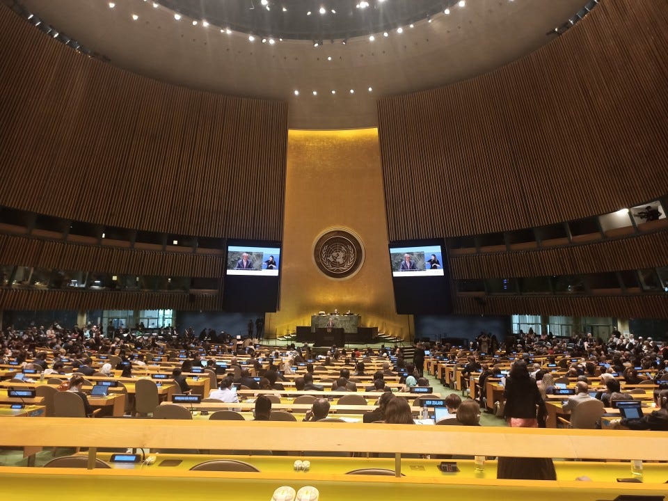 A photo of the UN General Assembly Hall during COSP16 in June 2023. The hall is filled with people from all over the world addressing the issue of the rights of persons with disabilities.