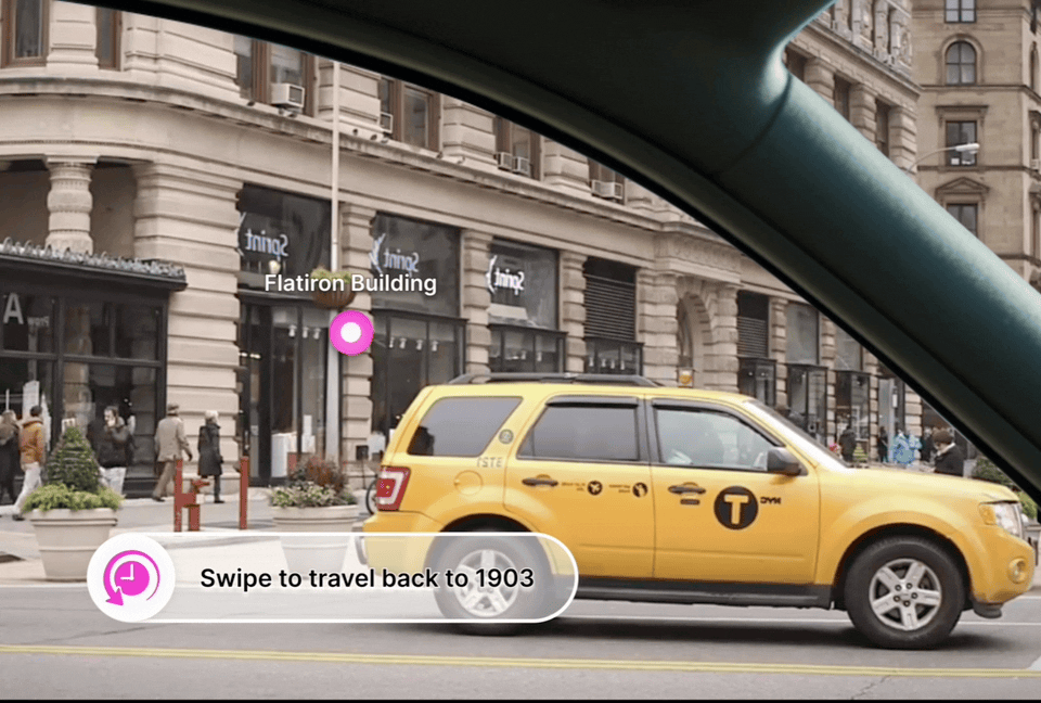 An animated gif of the flatiron building transforming to its historical state 100 years ago through the lens of a car window.