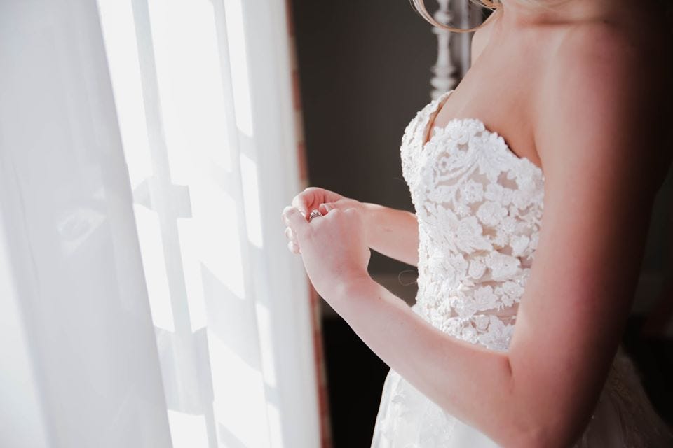 Bride twirling her wedding ring by Wildly Wed