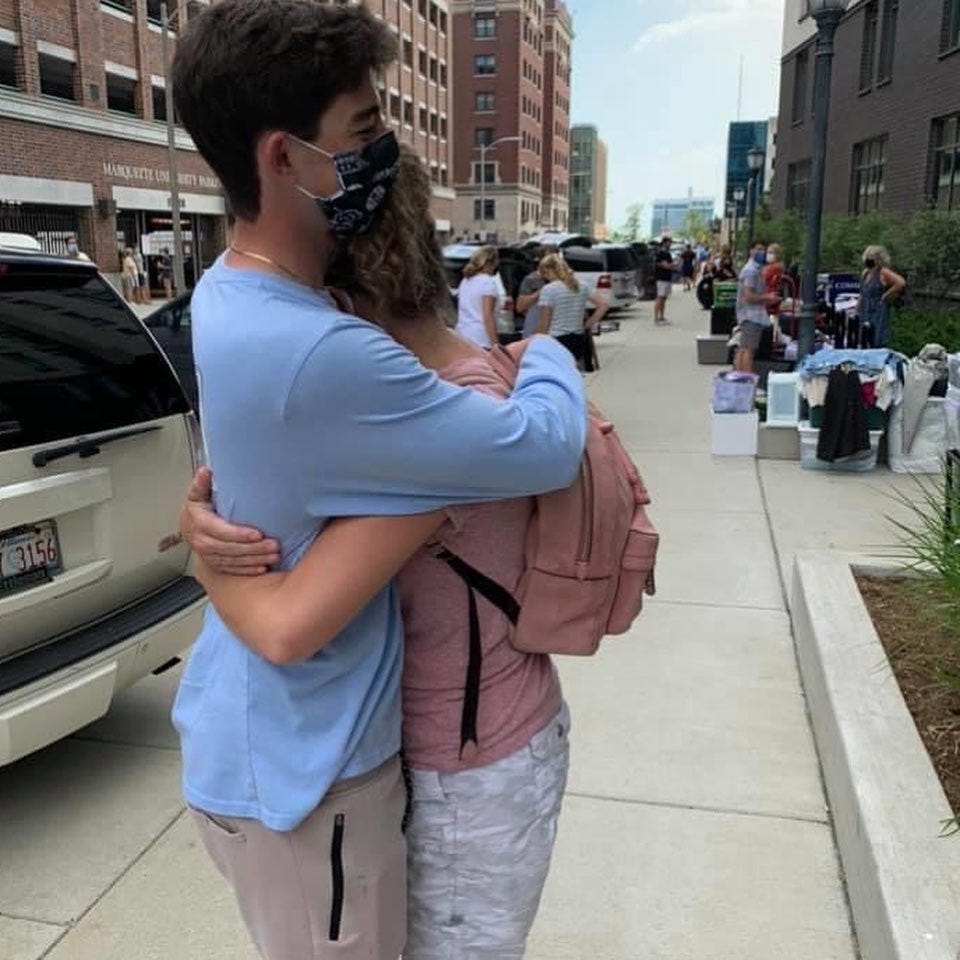 Photo of a student hugging a parent from Marquette move-in 2020
