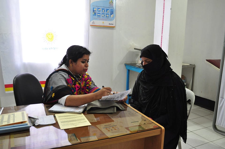 A network of Smiling Sun clinics throughout Bangladesh, supported by USAID, provides essential services to individuals and communities across the country. The Smiling Sun Clinic in Tongi, Bangladesh, now in its twenty-first year of operation, provides services, like immunization, free of charge to the ultra-poor through funds paid by other clients, ensuring the clinic’s sustainability. / Amy Fowler, USAID
