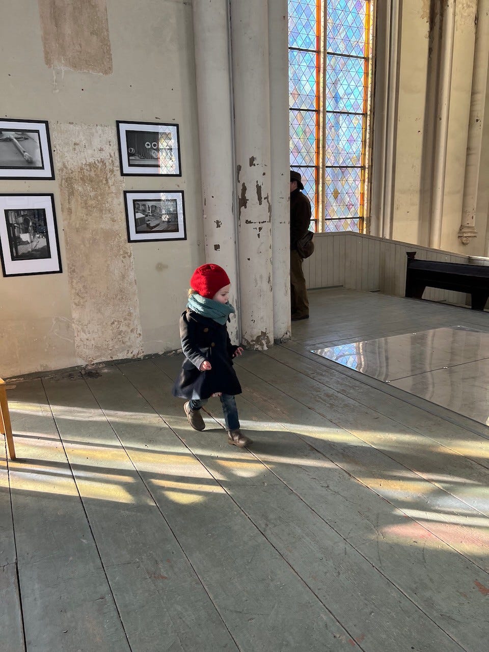 little girl exploring a church.