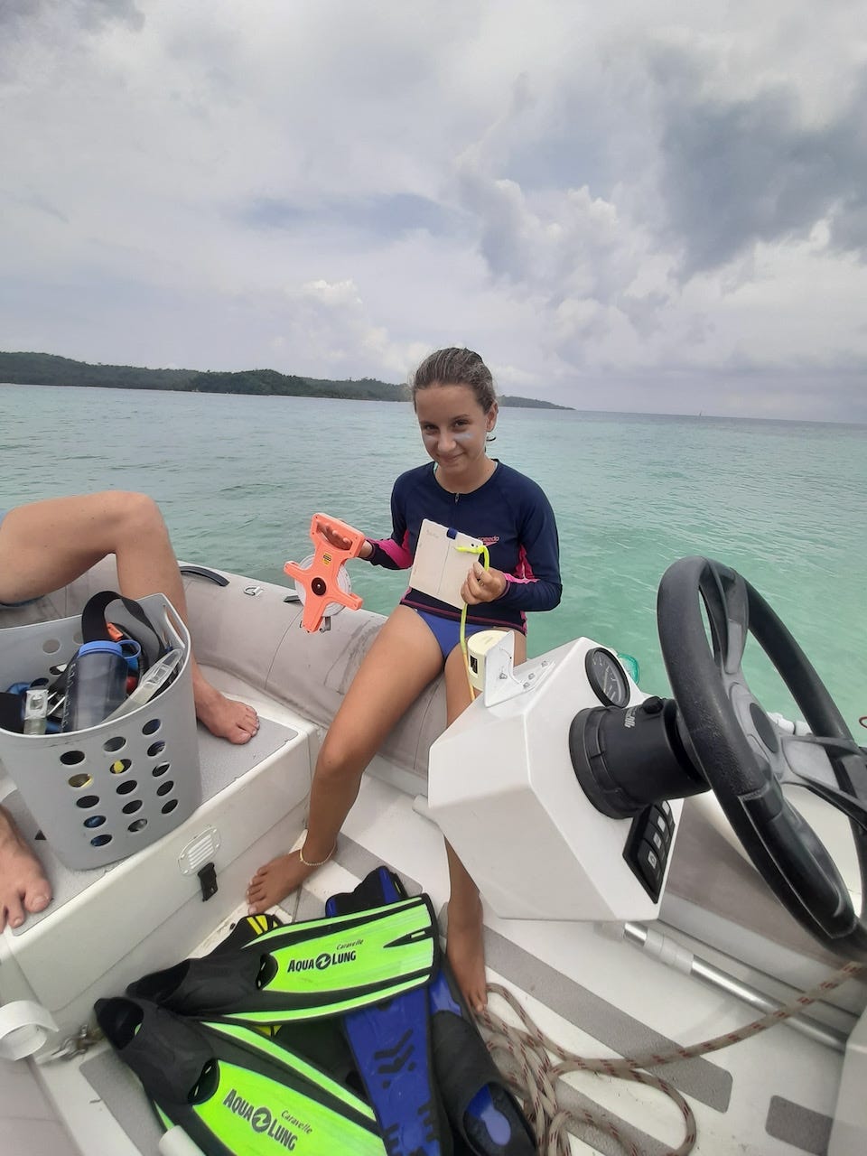 The author’s daughter, Jade, preparing to do a fish population study during boatschooling.