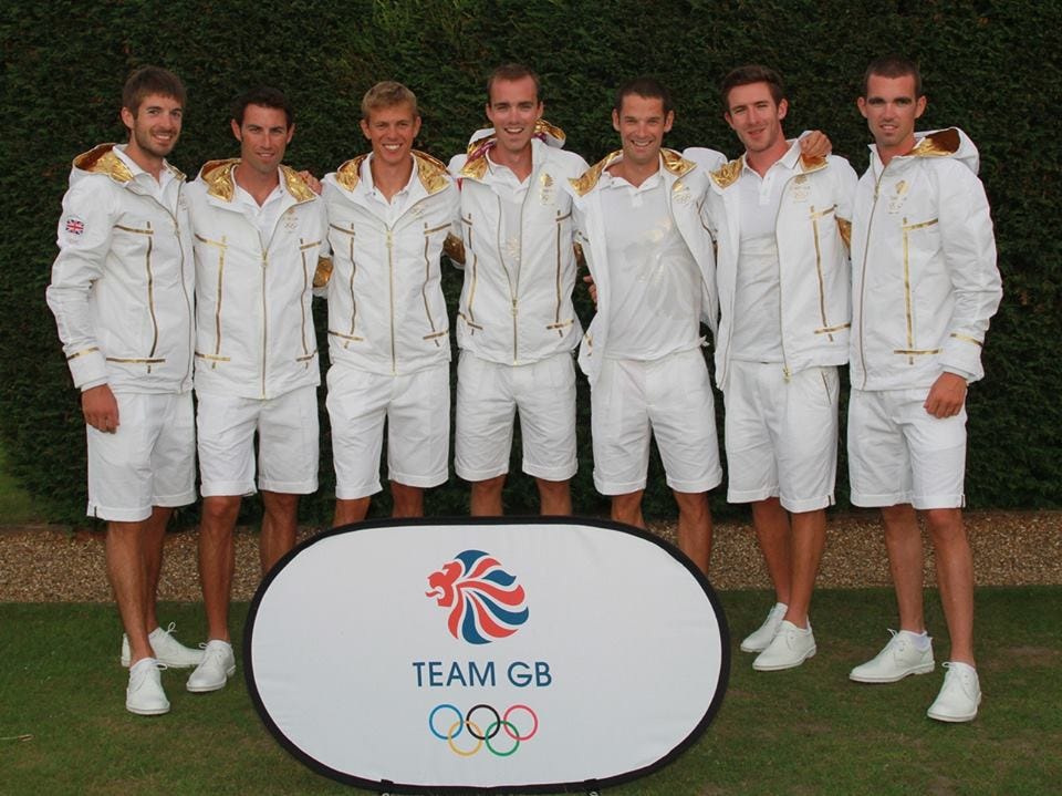 Olympic Men’s Lightweight rowing team in white and gold 2012 opening ceremony outfits.