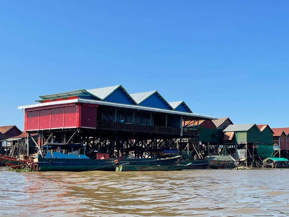 There boats and buildings on the water.