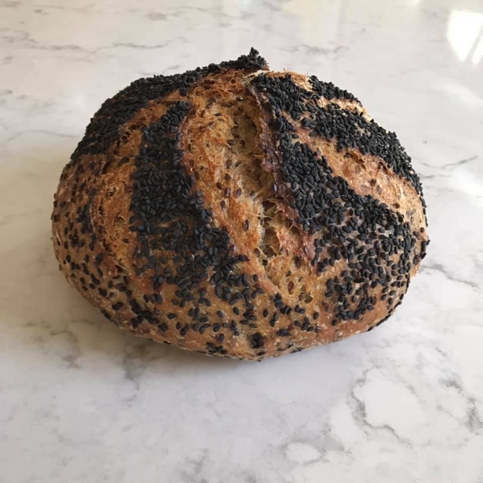 A boule topped with black sesame seeds.