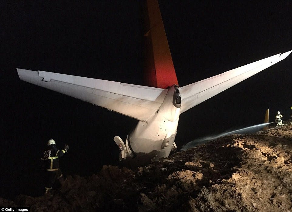 Emergency services rushed to the scene and began to douse the aircraft with jets of water 