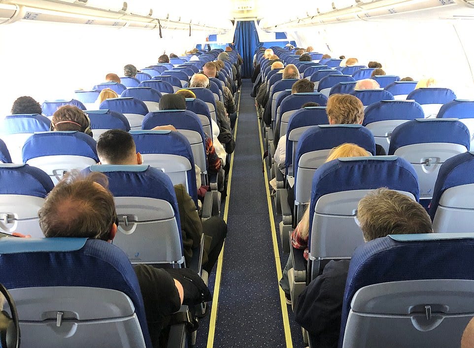 packed BA flight Amsterdam to Heathrow / Daily Mail