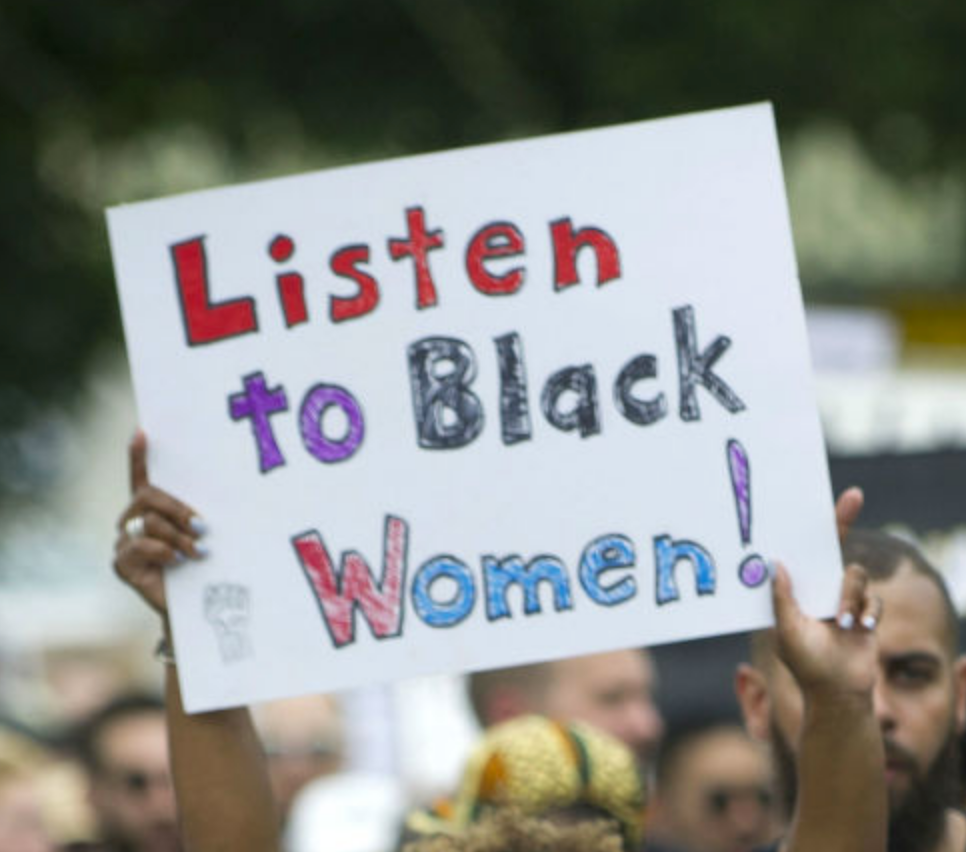 Sign saying "Listen to Black Women!"