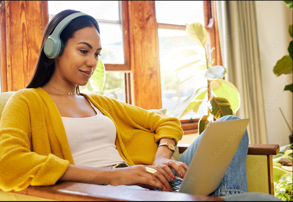 Woman working on laptop.