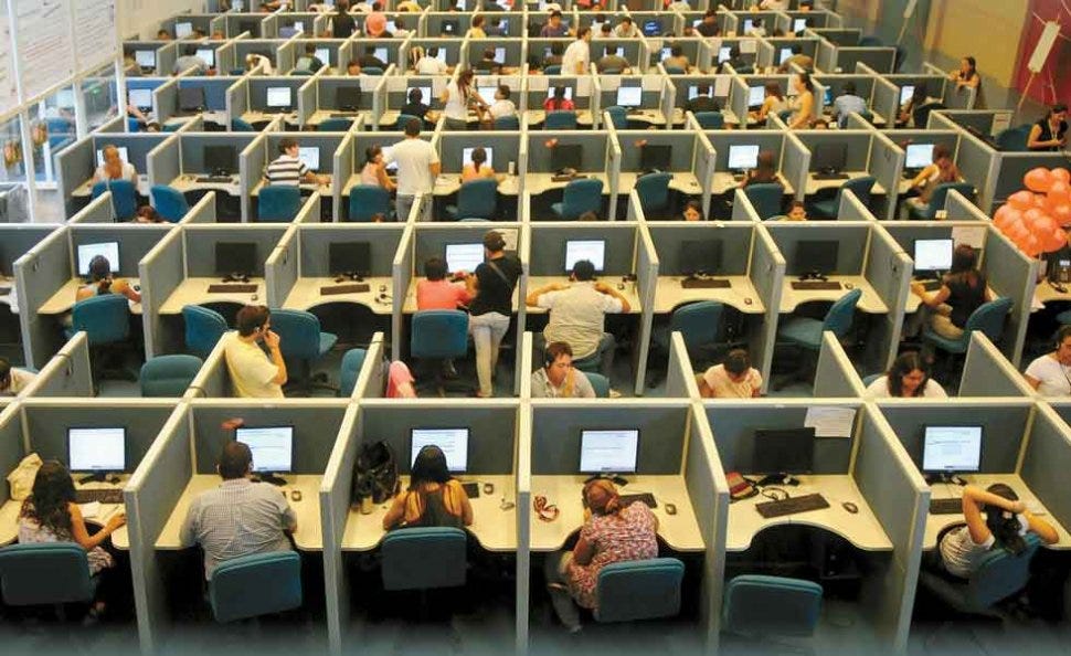 A cubicle farm of customer service agents.
