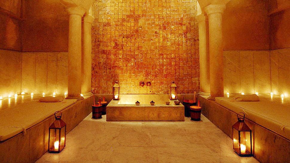 a candle light stone spa room