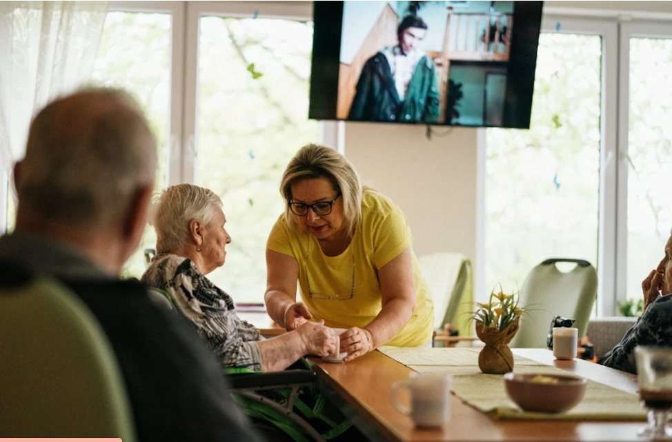 Blonde Woman Taking Care of Seniors