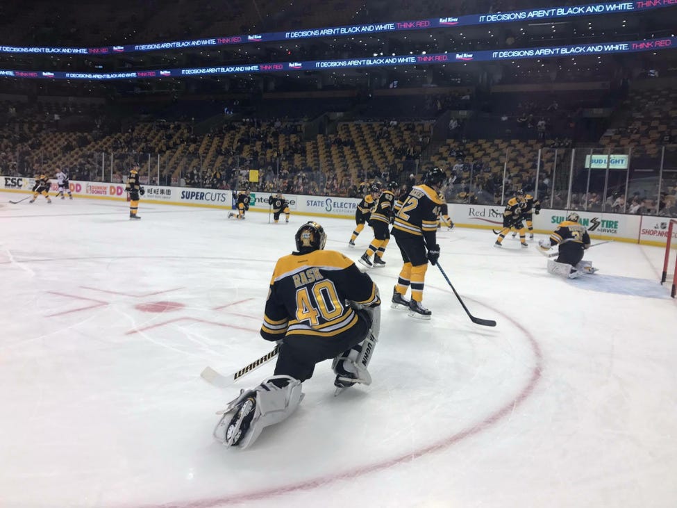 The even lighting offered here allows for the photo to appear even more crisp. Tuukka Rask of the Boston Bruins warms up prior to a game.