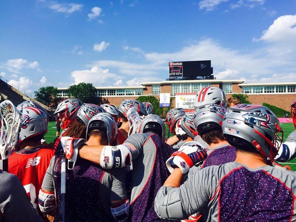 The Boston Cannons huddle together during warmups. 