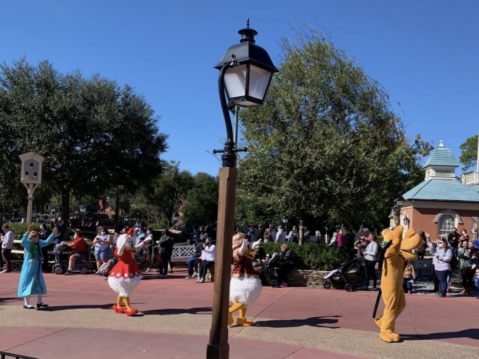 Pluto, Donald Duck, Daisy Duck, and Wendy (from Peter Pan) greeting guests.