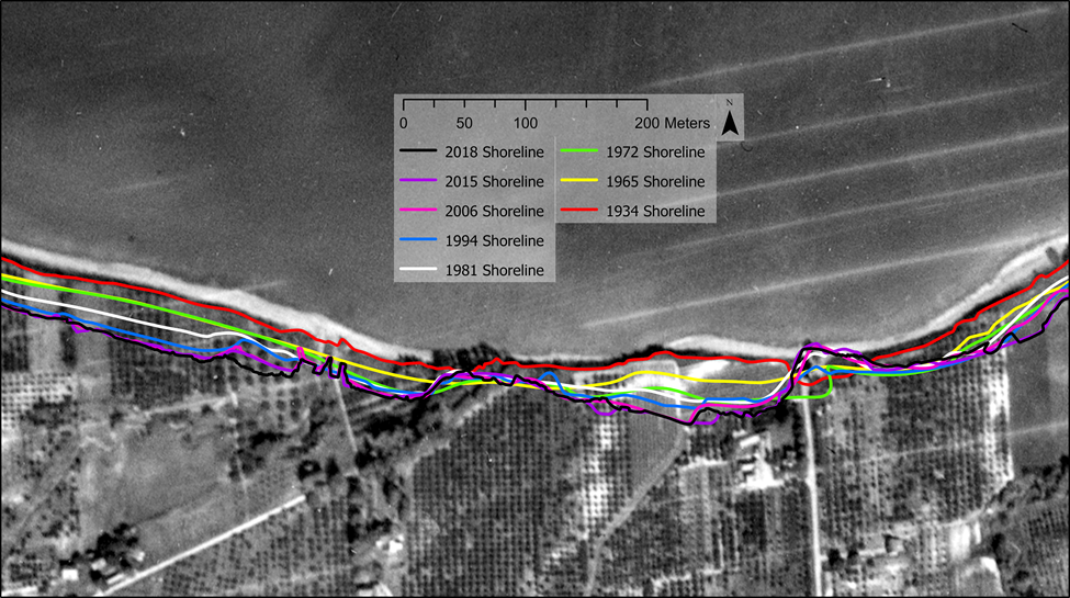 A black and white aerial photo of a shoreline with different coloured lines indicating the changes to the shoreline over the years.