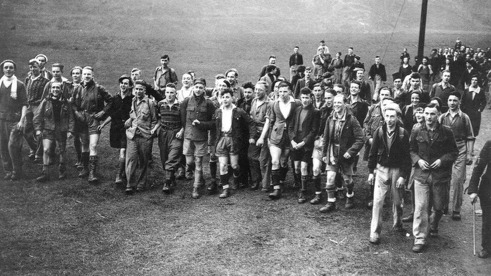 The Kinder Scout Trespass of 1932 with hundreds of working class people protesting access to land [Credit: Working Class Movement Library].