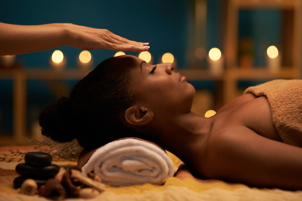 Woman gets Reiki treatment