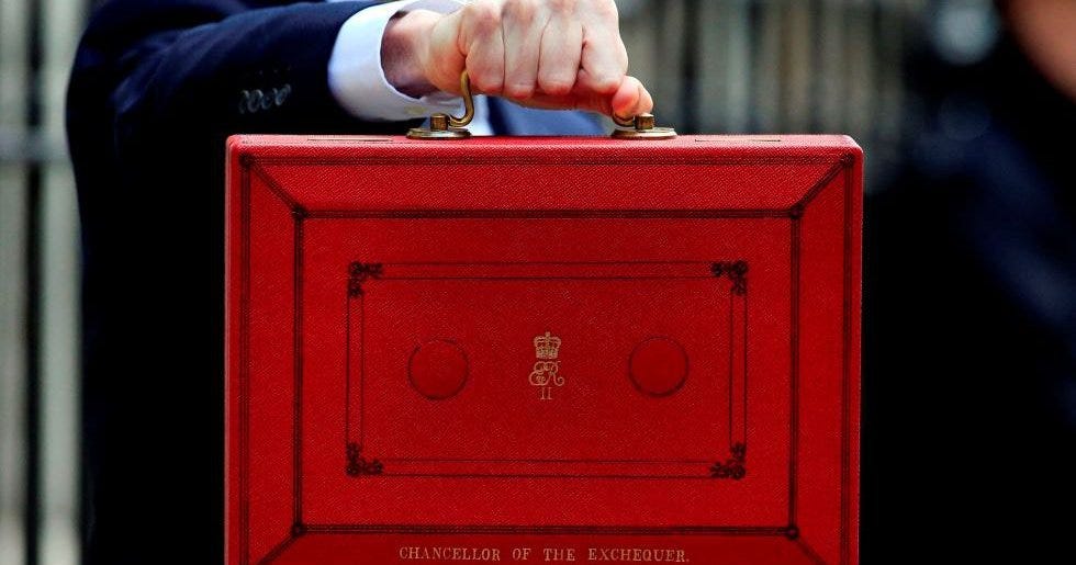 A hand holding the famous ‘red box’,  which includes the name Chancellor of the Exchequer.