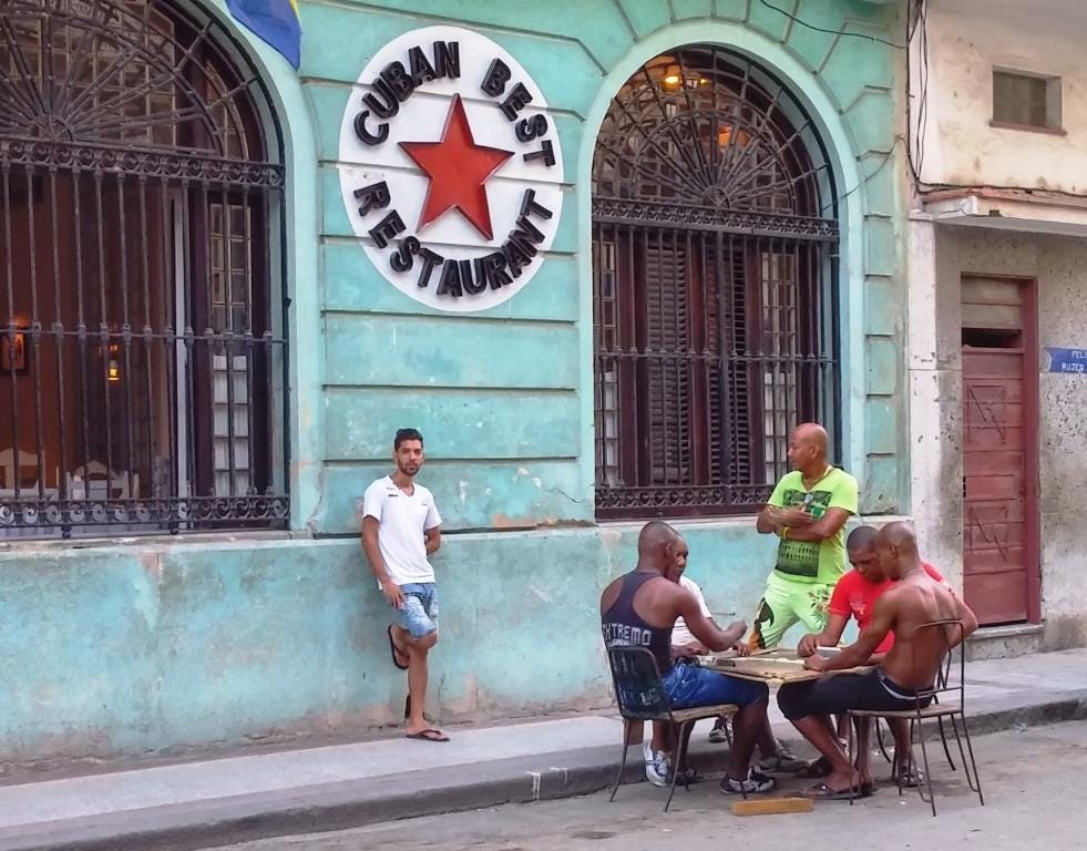 Cuban men play dominoes photo by Jenifer Joy Madden