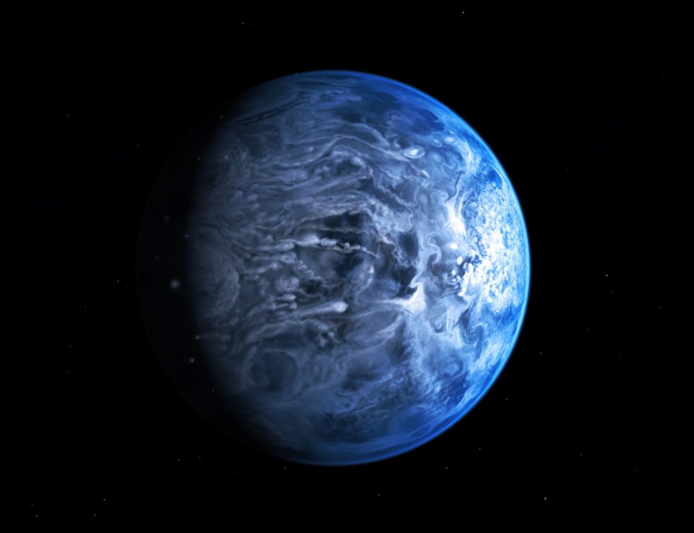 Artists impression of a blue planet swathed in white clouds with plain, black space in the background